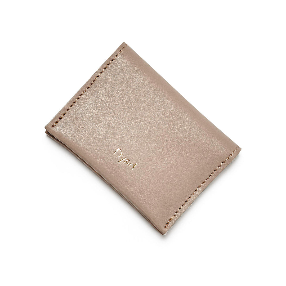Project Dyad Wave Cardholder in Stone, closed with gold Dyad logo