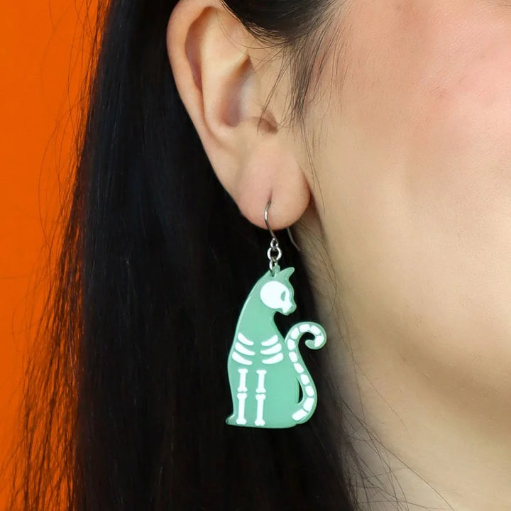 ERSTWILDER | EARRINGS | Bone Kitty Drop Earrings - Glow in the Dark