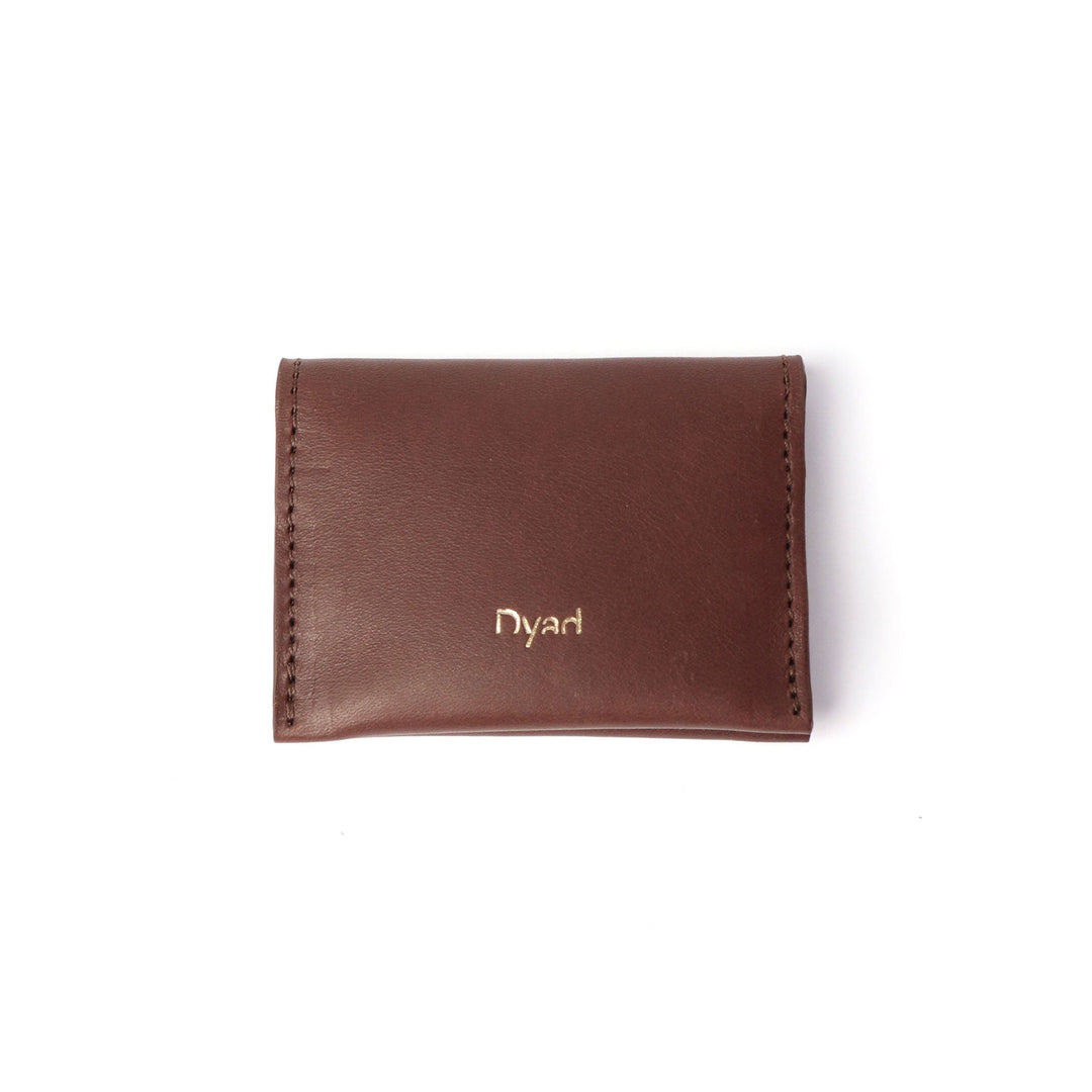 Project Dyad Wave Cardholder in Chocolate, closed with gold Dyad logo