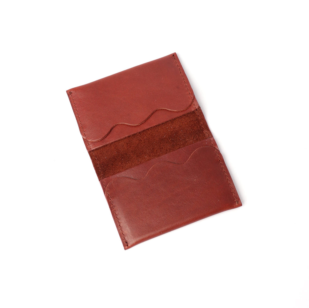 Project Dyad Wave Cardholder in Teak, open showing wave-edged card compartments