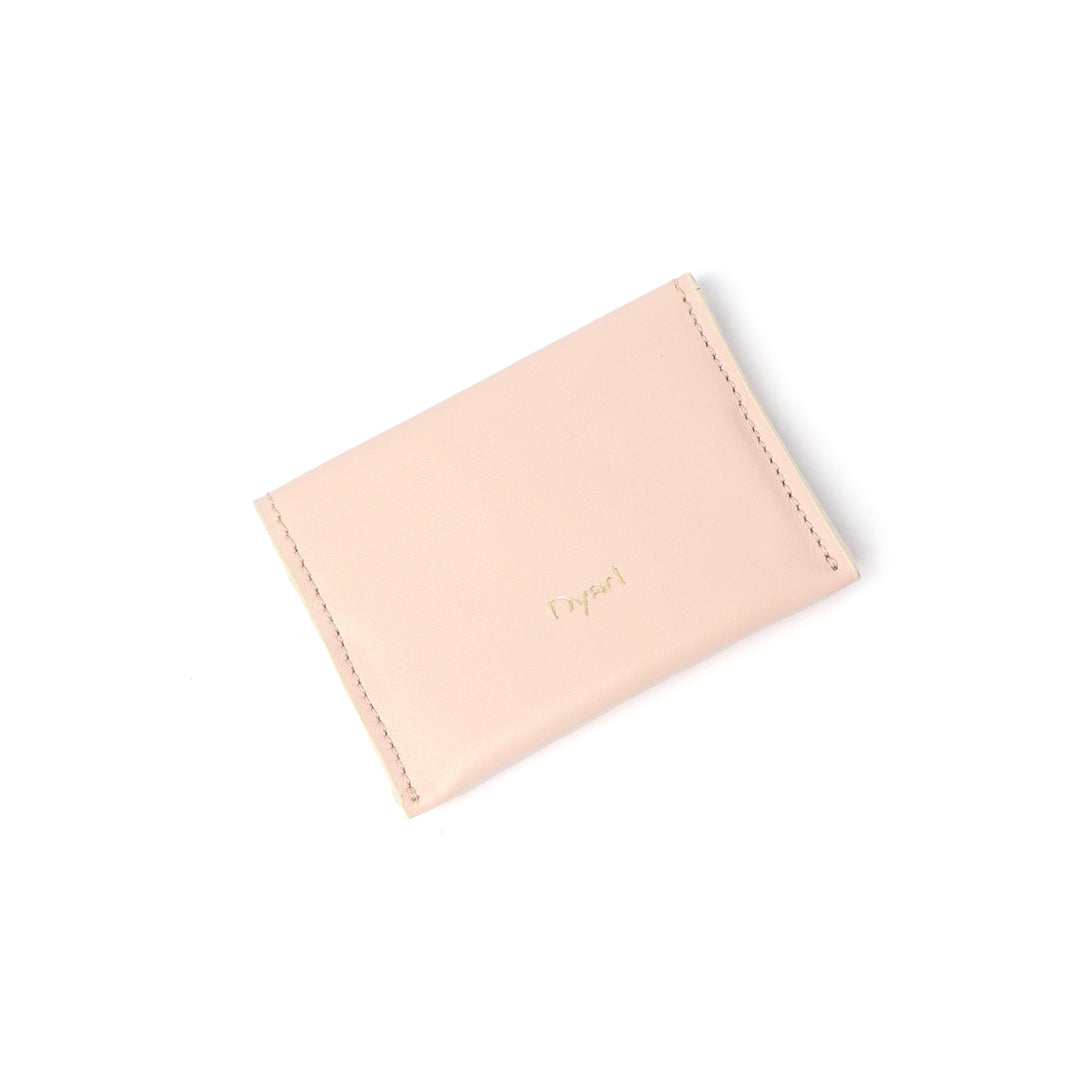 Project Dyad Wave Cardholder in Dusty Pink, closed with gold Dyad logo