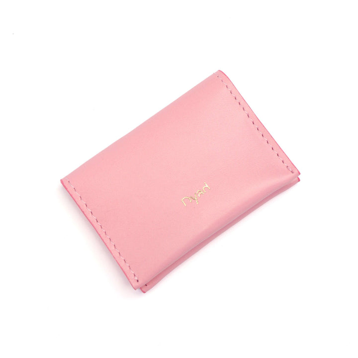 Project Dyad Wave Cardholder in Candy Pink, closed with gold Dyad logo