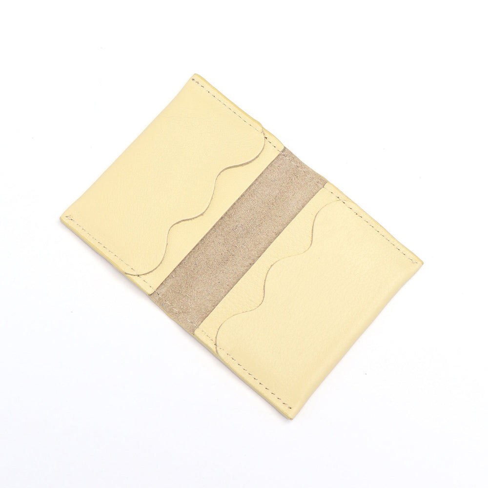 Project Dyad Wave Cardholder in Butter, open showing wave-edged card compartments