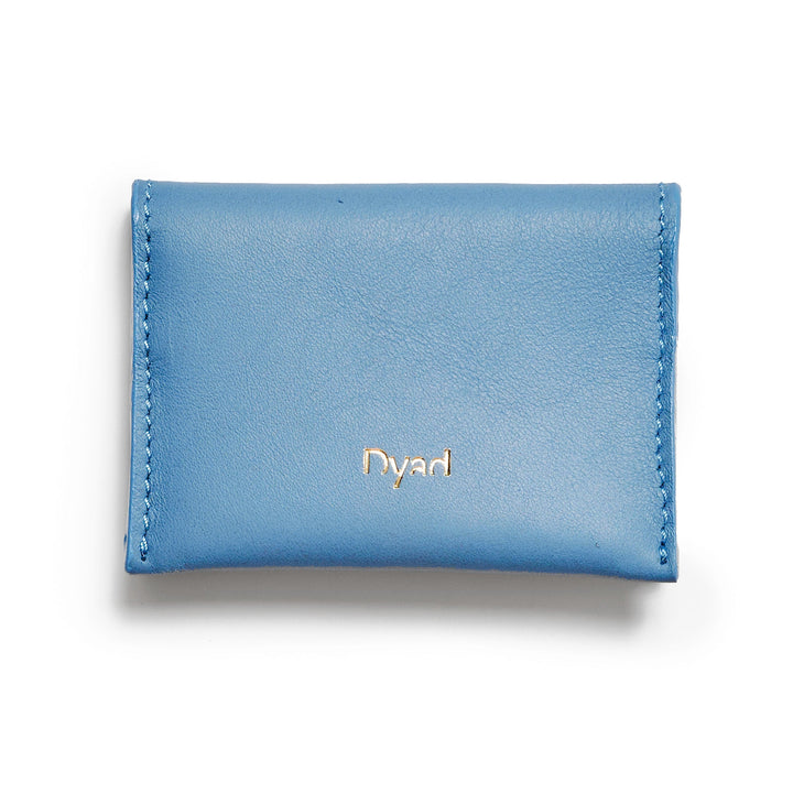 Project Dyad Wave Cardholder in Sky Blue, closed with gold Dyad logo
