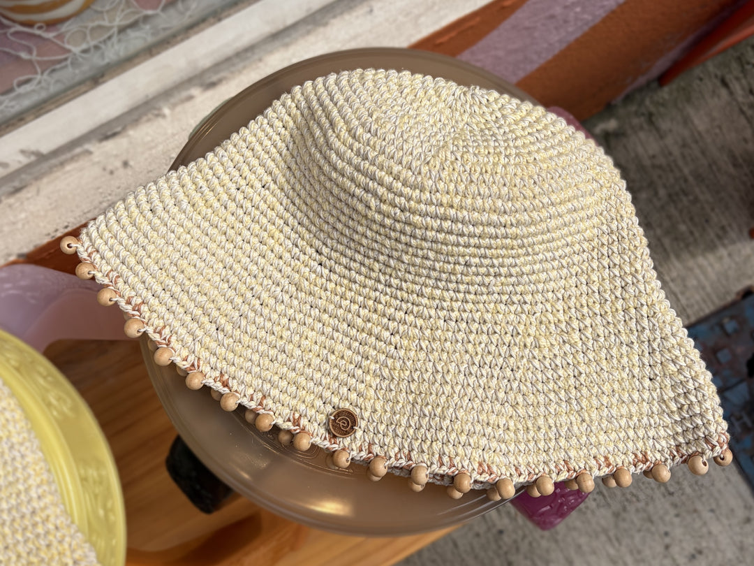 Earth Age x Goosebump exclusive Butter Yellow wooden-bead crochet hat, original photograph with natural background