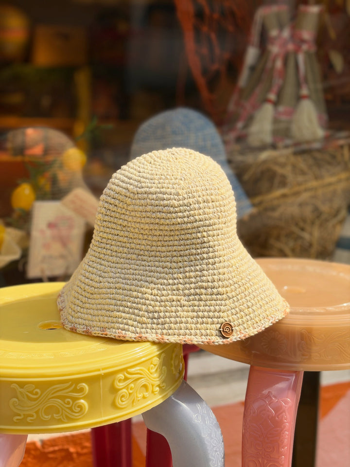 Earth Age x Goosebump Butter Yellow pink glass bead hat, original product photograph from the collaboration post