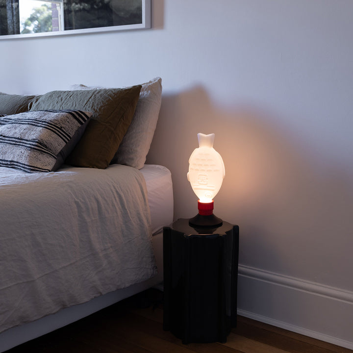 Heliograf Light Soy Flex beside a bed with optional base