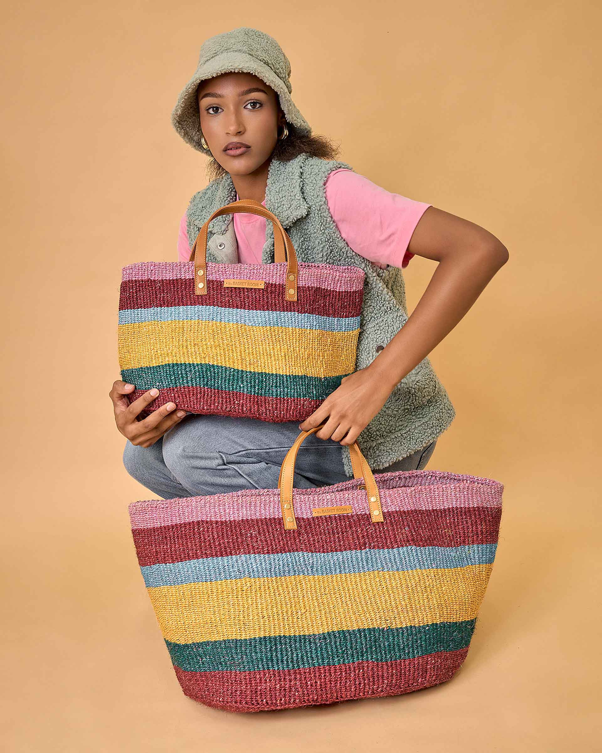 Official The Basket Room model wearing the HEKA striped woven bag