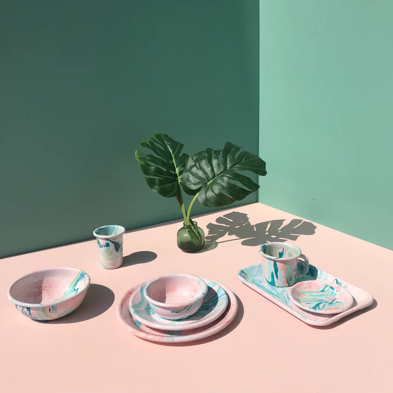 BORNN Blush and Tiffany Blue enamel tableware, styled with natural light and green leaves