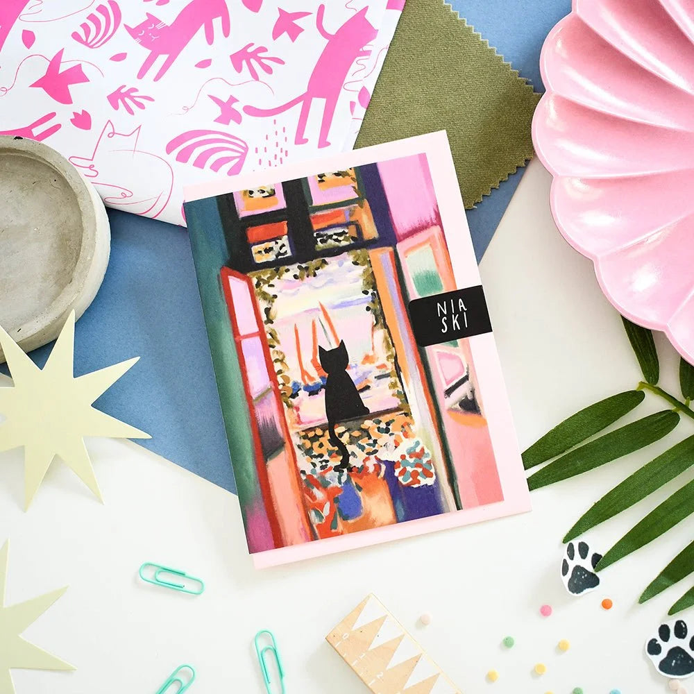 Catisse in the Window illustrated card flat lay