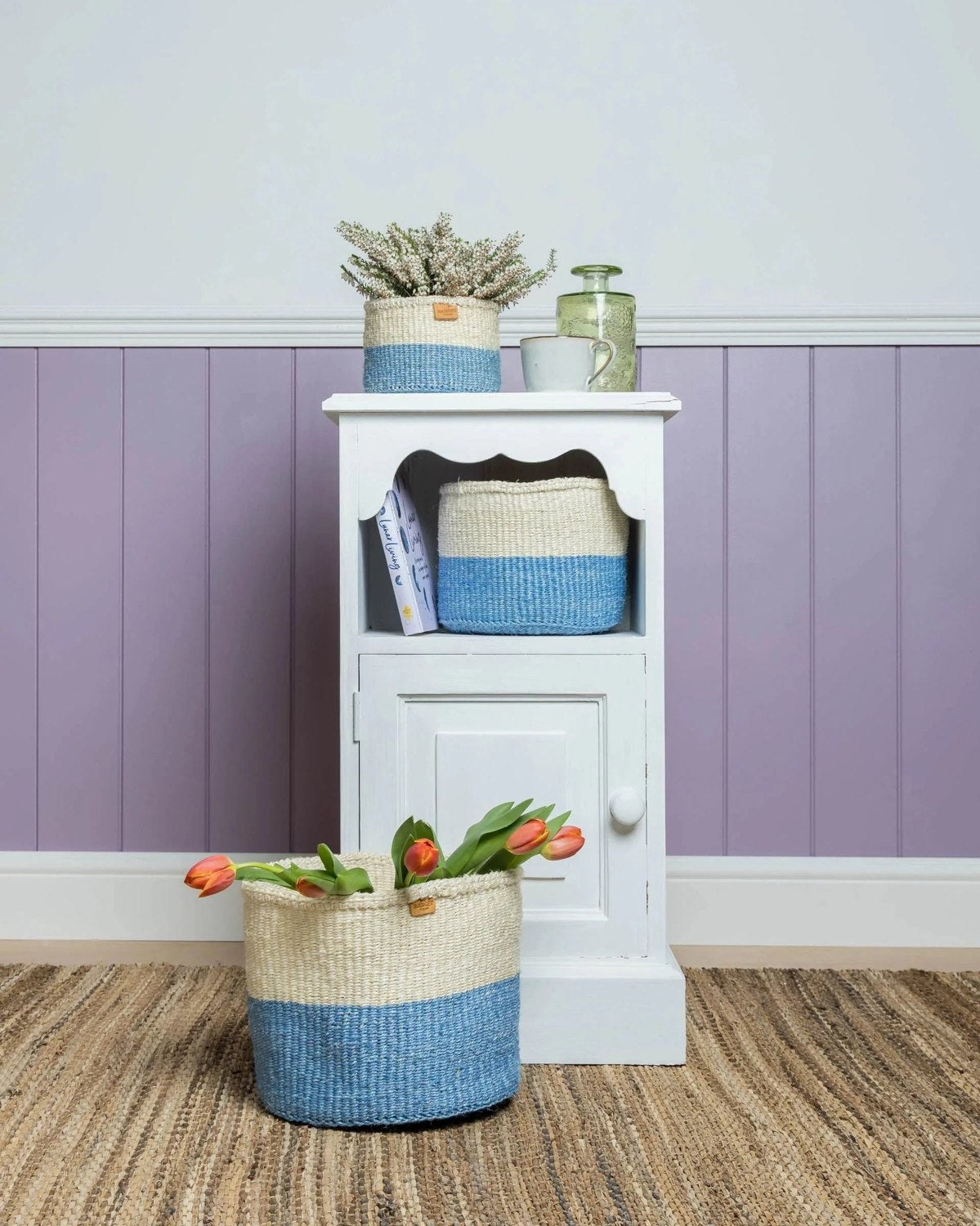 Official The Basket Room styling with a white cabinet and sky-blue woven baskets